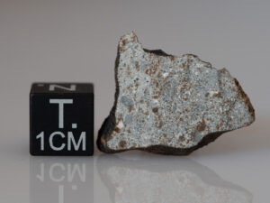 Camel Donga (eucrite) - 2.33g part slice crusted